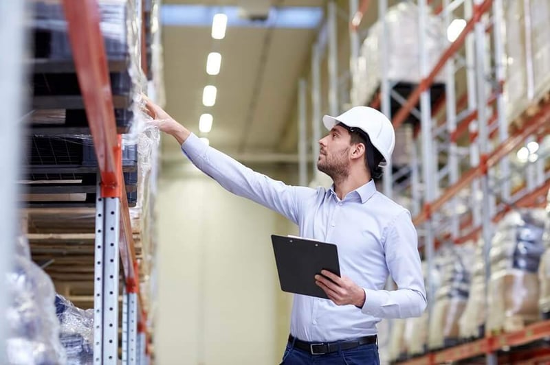 businessman-checking-inventory-in-warehouse